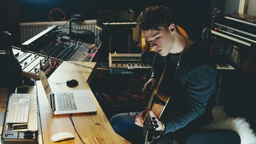 a boy plays guitar